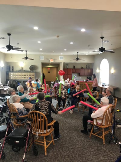 Residents engaging in a fun indoor activity.