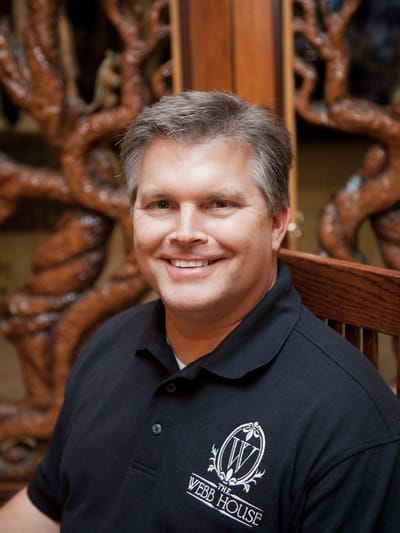 Staff member smiling in a facility setting