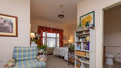 Cozy resident room with decorative elements.