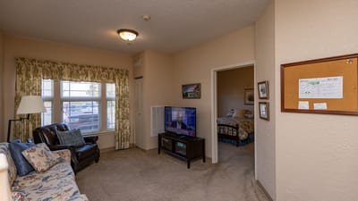 Cozy resident room with furniture and decor.
