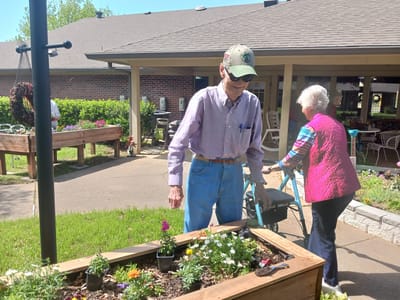 Residents gardening in an outdoor space.