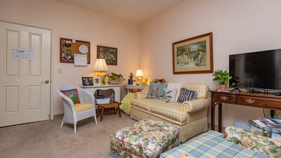Cozy living space with comfortable furniture and decorations.