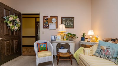 Cozy resident room with personal decor and furnishings.