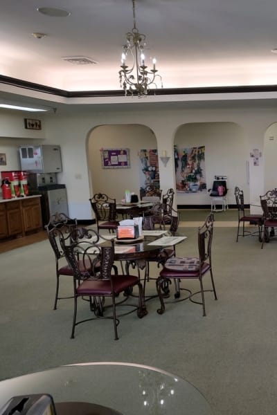 Decorated dining area with tables and chairs.