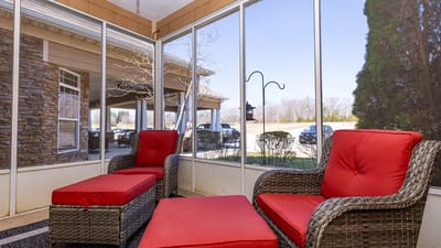 Comfortable seating area with red cushions