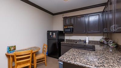 Clean kitchen area in a retirement center unit.