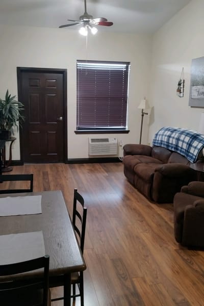 Cozy common area with seating and a table.