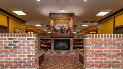 Interior common area with a fireplace and seating