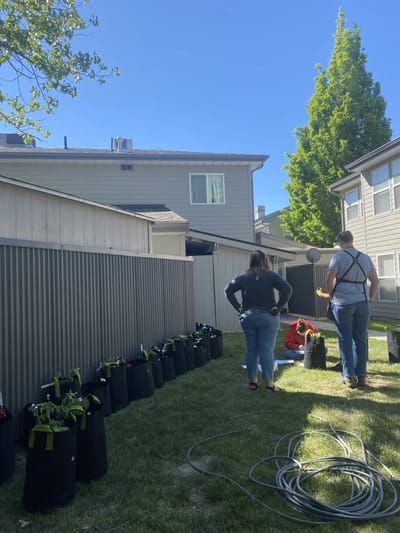 Residents participating in outdoor gardening activity.