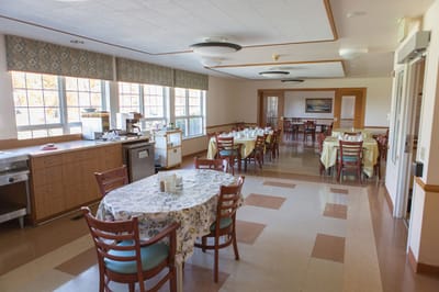 Bright dining area with tables and chairs