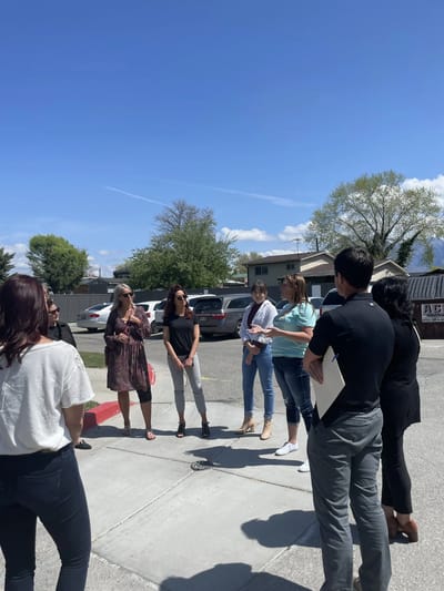 Group of people engaged in an outdoor discussion.