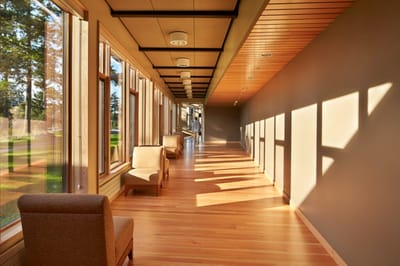 Bright hallway with chairs and large windows