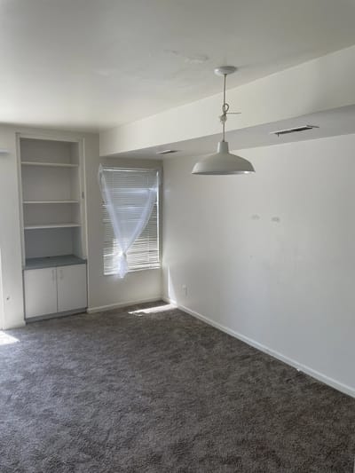 Empty room with carpet and window
