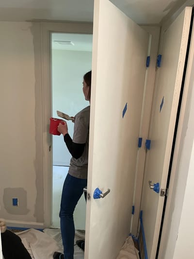 Staff painting interior walls at the facility.
