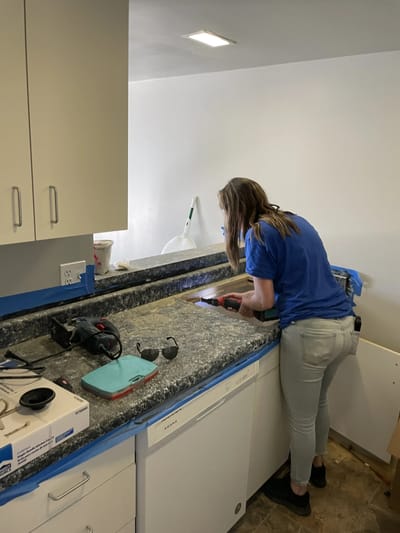 Staff member working on kitchen renovations