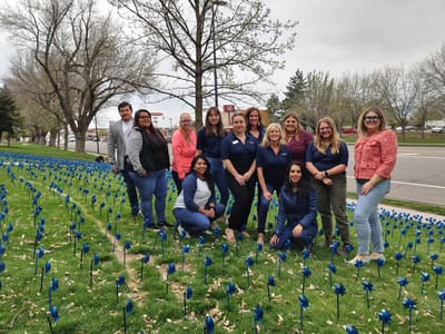 Group of staff members in a flower garden