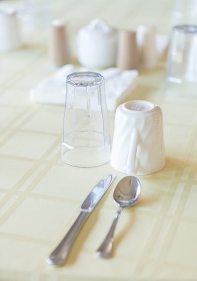 Table setting with utensils and glassware.