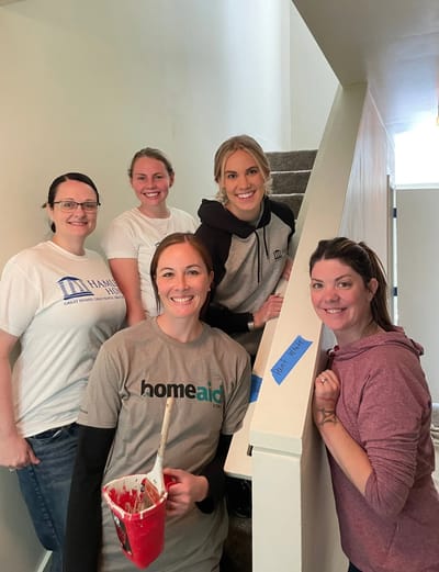 Group of volunteers working on a home project