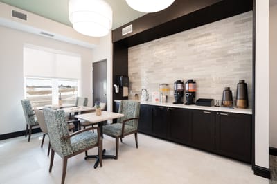 Bright common area with seating and refreshments