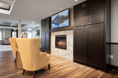 Common area with comfortable chairs and a fireplace