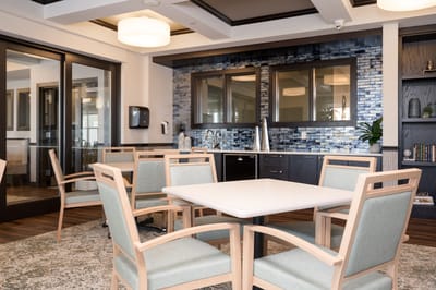 Well-furnished common area with seating and decor.