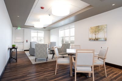 Bright common area with seating and artwork