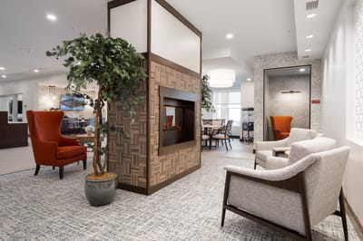 Common area with seating and fireplace