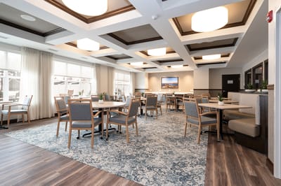 Bright common area with tables and chairs