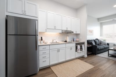 Modern kitchen area in a senior living apartment.