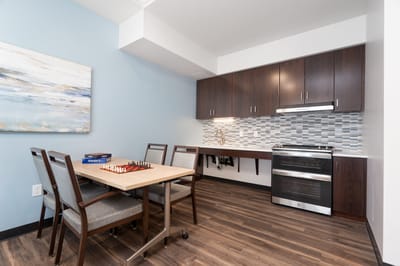 Cozy interior of a resident's apartment with a chess table.