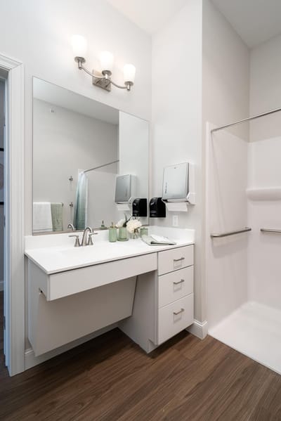 Modern bathroom with sink and shower.