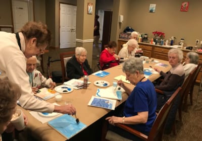 Residents participating in an art activity together.