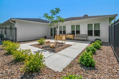 Well-maintained outdoor garden space with pathways.
