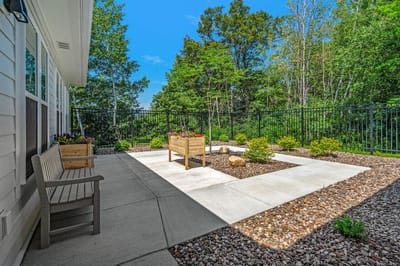 Outdoor garden space with benches and plants