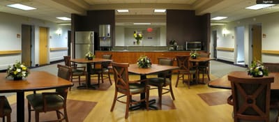 Bright dining room with tables set for meals