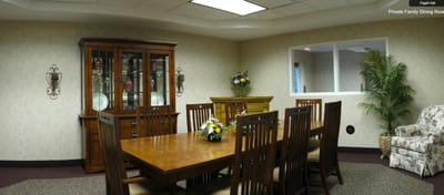 Private family dining room with a large wooden table and chairs