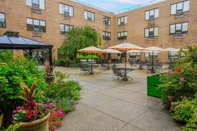 Outdoor seating area with umbrellas and flowers