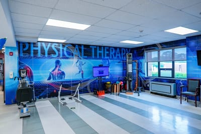 Interior view of a physical therapy room with equipment