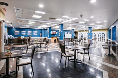 Interior view of a common area with tables and chairs