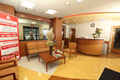 Interior lobby of a facility with seating and reception area