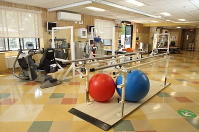 Physical therapy room with exercise equipment