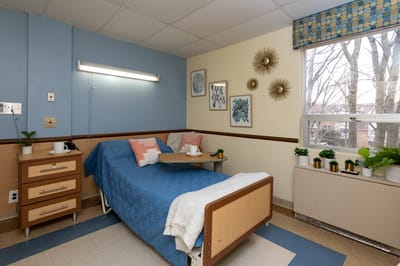 Cozy resident room with bed and decorations