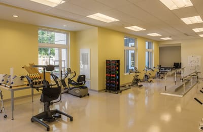 Physical therapy room with exercise equipment