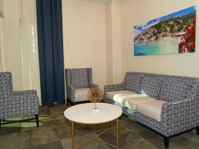 Interior seating area with patterned furniture and artwork