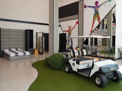 Interior view featuring a golf cart and workout area