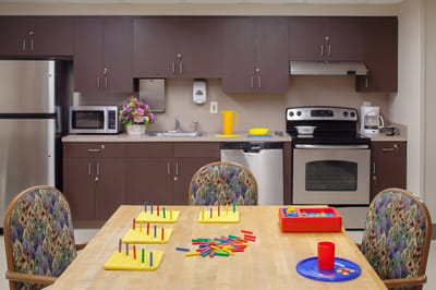 A well-equipped kitchen area with games and decor