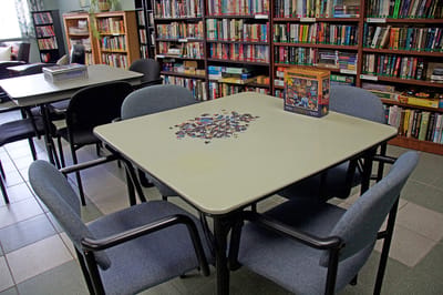 Activity room with a table set up for puzzles