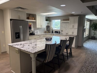 Modern kitchen with granite countertops and seating