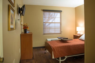 Cozy resident room with a bed and furniture