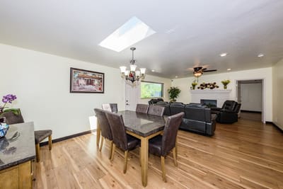 Bright common area with seating and dining table
